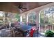 Covered deck area with a ceiling fan has outdoor dining area offers a comfortable and stylish space for entertaining at 2813 Long Grove Ct, Marietta, GA 30062