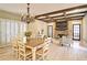 Dining area showcasing coffered ceilings, a stone fireplace, and natural light at 2813 Long Grove Ct, Marietta, GA 30062