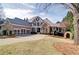 Attractive home with a three-car garage, stone accents, and a covered front porch, set on a spacious lawn at 2813 Long Grove Ct, Marietta, GA 30062