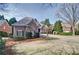 Inviting home featuring stone accents, manicured shrubs, and a well-maintained lawn leading to an arched entrance at 2813 Long Grove Ct, Marietta, GA 30062