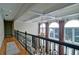 Elegant foyer with coffered ceilings, chandelier, and iron railing overlooking the living space below at 2813 Long Grove Ct, Marietta, GA 30062