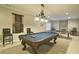 Spacious game room features a pool table, ping pong table, and cozy seating for entertaining guests at 2813 Long Grove Ct, Marietta, GA 30062