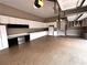 Large garage featuring custom cabinets, work space, epoxy flooring, and natural light at 2813 Long Grove Ct, Marietta, GA 30062