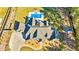 An aerial view of a well-maintained home with a pool, hot tub, and spacious backyard with mature trees at 650 New Morn Dr, Hampton, GA 30228