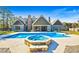 Beautiful backyard featuring pool, hot tub, and ample space for outdoor enjoyment and entertainment at 650 New Morn Dr, Hampton, GA 30228