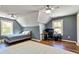 Gray bedroom featuring two windows, wood floors, and great natural light at 650 New Morn Dr, Hampton, GA 30228