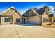 A well-maintained home featuring a spacious three-car garage and elegant mix of brick and siding at 650 New Morn Dr, Hampton, GA 30228