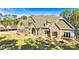 A beautiful view of an inviting home featuring a mix of brick and siding with a perfectly landscaped yard at 650 New Morn Dr, Hampton, GA 30228