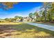 Traditional home with a long driveway and mature trees at 650 New Morn Dr, Hampton, GA 30228