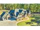 A stately home with a sprawling driveway, lush lawn, and classic architectural details at 650 New Morn Dr, Hampton, GA 30228