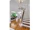 Inviting foyer with hardwood floors, staircase, and dining room at 650 New Morn Dr, Hampton, GA 30228