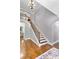 Staircase with a view of hardwood floors and an open floor plan at 650 New Morn Dr, Hampton, GA 30228