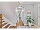 Hallway with hardwood floors and a view into another room at 650 New Morn Dr, Hampton, GA 30228