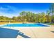 Large in-ground pool surrounded by concrete deck, ideal for entertaining and relaxation at 650 New Morn Dr, Hampton, GA 30228