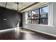 Stylish bedroom with large windows, modern lighting fixtures and hardwood floors at 115 W Peachtree Nw Pl # 602, Atlanta, GA 30313