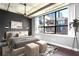 Comfortable bedroom with large windows providing ample natural light and city views at 115 W Peachtree Nw Pl # 602, Atlanta, GA 30313