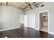 Spacious bedroom showcasing hardwood floors, neutral paint, closet, and bathroom entrance at 115 W Peachtree Nw Pl # 602, Atlanta, GA 30313