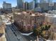 Brick building with lots of natural light from many windows and mature trees at 115 W Peachtree Nw Pl # 602, Atlanta, GA 30313