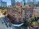 Brick building with a well-lit exterior showing a perfect neighborhood to live in at 115 W Peachtree Nw Pl # 602, Atlanta, GA 30313