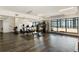 Modern gym with fitness machines and panoramic city views, offering a great workout experience at 115 W Peachtree Nw Pl # 602, Atlanta, GA 30313