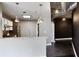 Modern kitchen boasts white cabinets, stainless steel appliances, marble countertops, and pendant lighting at 115 W Peachtree Nw Pl # 602, Atlanta, GA 30313