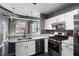 Modern kitchen featuring stainless steel appliances, marble countertops, and stylish backsplash at 115 W Peachtree Nw Pl # 602, Atlanta, GA 30313