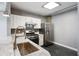 Beautiful kitchen with stainless steel appliances, marble countertops and backsplash and modern fixtures at 115 W Peachtree Nw Pl # 602, Atlanta, GA 30313