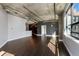 Spacious living room features hardwood floors, concrete ceiling and large windows that bring in lots of light at 115 W Peachtree Nw Pl # 602, Atlanta, GA 30313