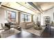 Bright living space featuring a dining area and comfortable seating, with large windows overlooking the city at 115 W Peachtree Nw Pl # 602, Atlanta, GA 30313