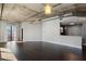 Bright and airy living room with hardwood floors, modern lighting and access to outdoor balcony with city views at 115 W Peachtree Nw Pl # 602, Atlanta, GA 30313