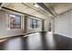 Inviting living area with hardwood floors, concrete pillars and exposed ductwork, filled with natural light at 115 W Peachtree Nw Pl # 602, Atlanta, GA 30313