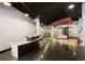 Open lobby area with marble reception desk and hardwood flooring at 115 W Peachtree Nw Pl # 602, Atlanta, GA 30313