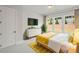 Cozy bedroom featuring natural light from three windows, a white dresser, and a comfortable bed with yellow accents at 1956 Freestone Way, Marietta, GA 30064