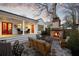 Inviting backyard with a stone patio, outdoor fireplace, and comfortable lounge seating at dusk at 255 Maple Nw Ave, Marietta, GA 30064