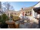 Large backyard patio with outdoor seating, dining, and covered lounge area at 255 Maple Nw Ave, Marietta, GA 30064