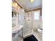 Well-lit bathroom featuring a glass shower, hexagonal floor tiles, and classic fixtures at 255 Maple Nw Ave, Marietta, GA 30064