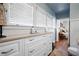 Bathroom with ample storage, white wainscoting and natural light at 255 Maple Nw Ave, Marietta, GA 30064