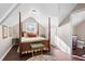 Cozy bedroom with a four-poster bed, hardwood floors, and natural light at 255 Maple Nw Ave, Marietta, GA 30064