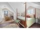 Bright bedroom featuring hardwood floors, a four-poster bed, and ample natural light at 255 Maple Nw Ave, Marietta, GA 30064