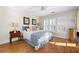 Bright bedroom with hardwood floors and shuttered windows at 255 Maple Nw Ave, Marietta, GA 30064