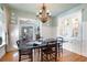 Formal dining room featuring hardwood floors, decorative lighting, and bright light at 255 Maple Nw Ave, Marietta, GA 30064