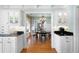 Open view from kitchen into the dining area featuring hardwood floors and natural light at 255 Maple Nw Ave, Marietta, GA 30064