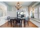Formal dining room with hardwood floors, decorative lighting, and large window seat at 255 Maple Nw Ave, Marietta, GA 30064