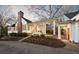 Elegant home exterior with a covered porch, outdoor entertaining area, and lush landscaping at 255 Maple Nw Ave, Marietta, GA 30064
