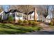 Beautifully landscaped white home with manicured lawn and tasteful plantings surrounding the property at 255 Maple Nw Ave, Marietta, GA 30064