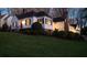 Charming two-story home with a red door, black shutters, and manicured landscaping at 255 Maple Nw Ave, Marietta, GA 30064