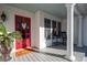 Inviting front porch with white columns, red door, rocking chair, blue ceiling, and landscape at 255 Maple Nw Ave, Marietta, GA 30064