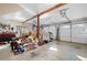 Spacious three car garage featuring multiple garage door openers and storage shelves at 255 Maple Nw Ave, Marietta, GA 30064