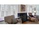Living room features a fireplace, built-in window seating, and traditional decor at 255 Maple Nw Ave, Marietta, GA 30064