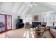 Inviting living room boasts vaulted ceiling, fireplace, and access to outdoor patio through French doors at 255 Maple Nw Ave, Marietta, GA 30064